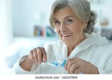 Senior Woman Brushing Her Teeth