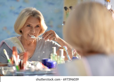 Senior Woman Brushing Her Teeth