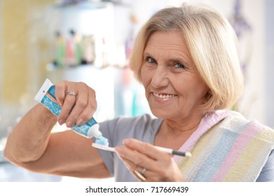 Senior Woman Brushing Her Teeth