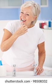 Senior Woman Brushing Teeth