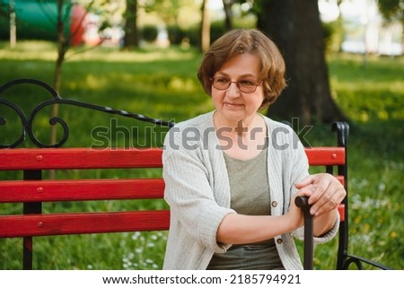 Similar – Smiling senior woman in wheelchair