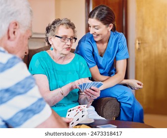 Senior woman, card game and nurse in retirement home for fun with recreational activities with friends or roommates. Smile, caregiver and assistance with pensioner in living room with happiness. - Powered by Shutterstock