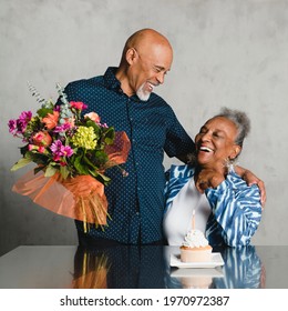 Senior woman celebrating her birthday with her husband - Powered by Shutterstock