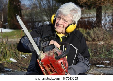 Senior Woman With Chainsaw