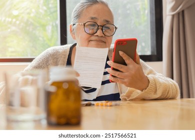 Senior woman checking prescription and find information about medicines by her phone. Elderly lady reading medical instructions before taking medicine. Selective focus. - Powered by Shutterstock