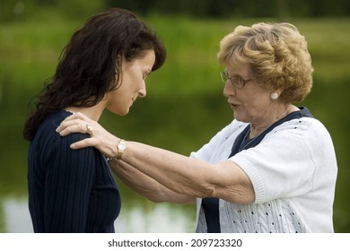 Senior Woman Consoling Her Daughter - Powered by Shutterstock