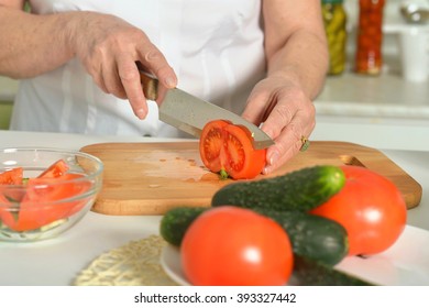 Senior Woman Cooking In Kitchen