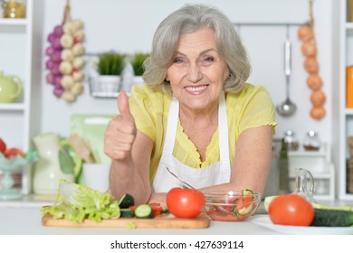 Senior Woman Cooking In Kitchen