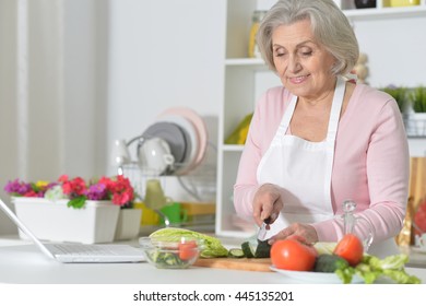 Senior Woman Cooking In Kitchen