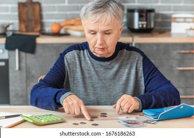 Senior Woman Counting Money At Home