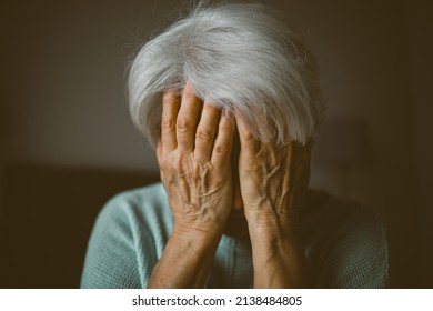 Senior woman covering face with her hands 
 - Powered by Shutterstock