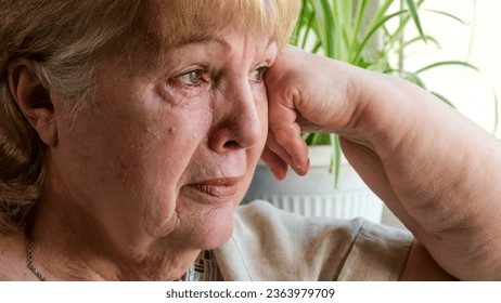 Senior woman crying at home. Pain, disappointment and depression - Powered by Shutterstock