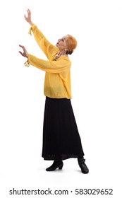 Senior Woman Is Dancing. Old Lady Raising Arms Isolated.