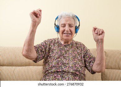 Senior Woman Dancing While Listening Music