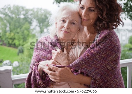 Similar – Female caretaker posing with elderly patient