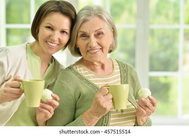 Senior Woman With Daughter  With Tea