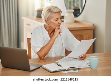 Senior woman, debt and laptop bills payment for loan budget and retirement finance paperwork at home. Retired Ukraine elderly person reading pension, loan and mortgage savings financial bank report - Powered by Shutterstock