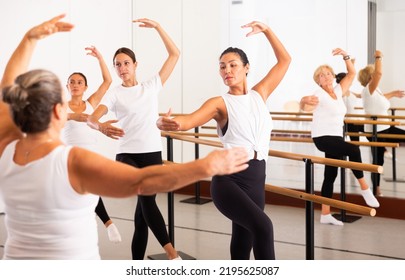 Senior Woman Demonstraiting Ballet Moves During Group Dance Training.
