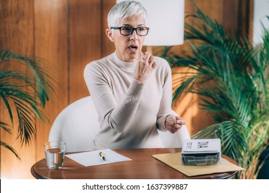 Senior Woman Doing DNA Test At Home.