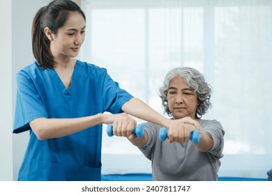 senior woman doing exercise at clinic with physiotherapist. help of a personal trainer during a rehabilitation session. - Powered by Shutterstock