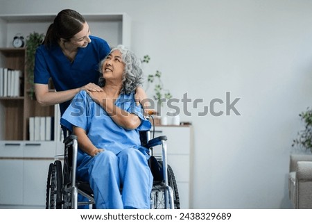 Similar – Doctor talking to elderly patient in a wheelchair