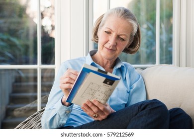 Senior Woman Doing Sudoku Puzzles