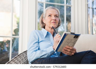 Senior Woman Doing Sudoku Puzzles