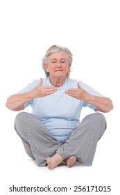 Senior Woman Doing Yoga Exercise On White Background