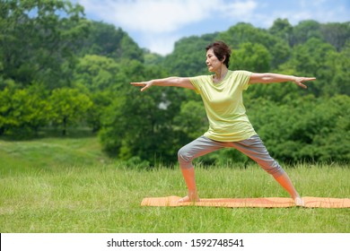 Senior Woman Doing Yoga Outdoors