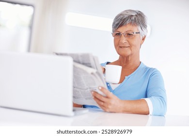 Senior woman, drinking coffee and reading newspaper for press story, information or relax in retirement. Tea, home or person with news article for morning routine, politics or report update on laptop - Powered by Shutterstock