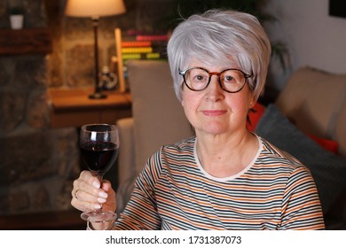 Senior Woman Drinking Red Wine 