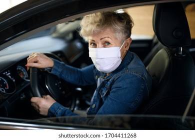 Senior Woman Driver With Face Mask In Car, Quarantine Concept.