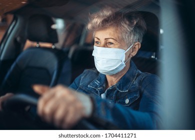 Senior Woman Driver With Face Mask In Car, Quarantine Concept.