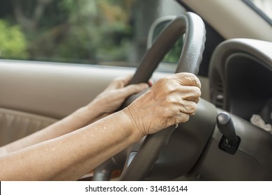 Senior Woman Driving A Car