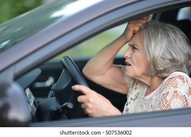 senior woman driving car