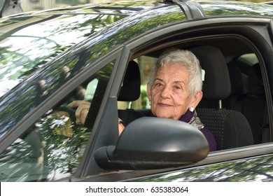 Senior Woman Driving A Car