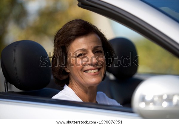 A senior woman driving a
car