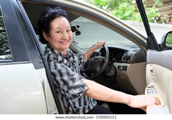 Senior woman driving
car