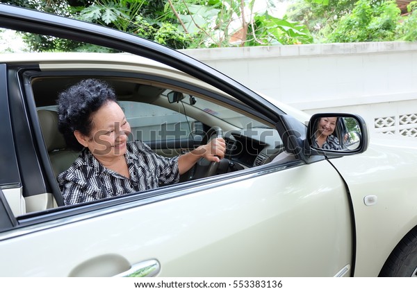  Senior woman driving
car