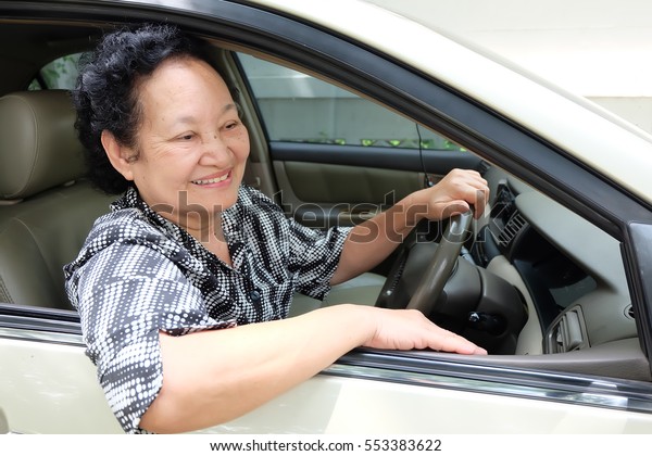  Senior woman driving\
car