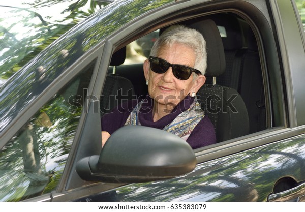 senior woman driving a
car