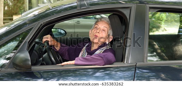 senior woman driving a
car