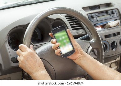 senior woman driving car and calling with mobile phone - Powered by Shutterstock