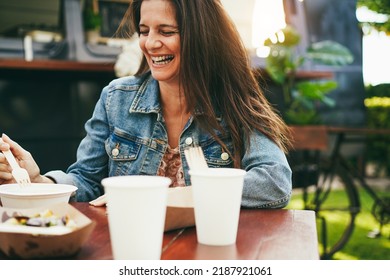 Senior Woman Eating At Food Truck Restaurant Outdoor - Main Focus On Right Eye