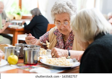 senior woman eating her lunch at home