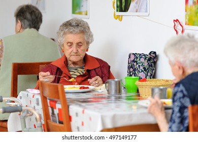 senior woman eating her lunch at home