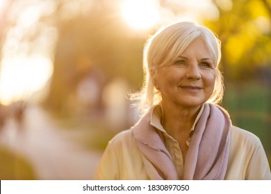 Senior woman enjoying autumn colors at sunset
 - Powered by Shutterstock