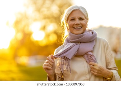 Senior woman enjoying autumn colors at sunset
 - Powered by Shutterstock