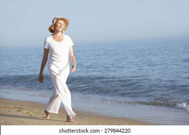 Senior Woman Enjoying Beach Holiday