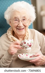 Senior Woman Enjoying Cup Of Tea At Home